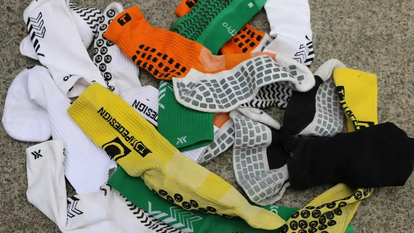 Grip socks in football boots, showing how grip socks sit inside the boot before a match