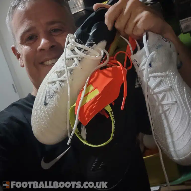Ian Ebbs, FootballBoots.co.uk, holding wide-fit football boots he has tested in real matches